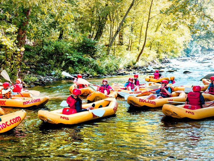 Scouts in kayaks on the river